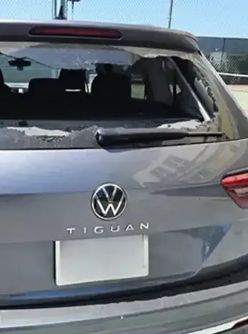 Rear view image of a gray Volkswagen Tiguan with Broken Back Glass