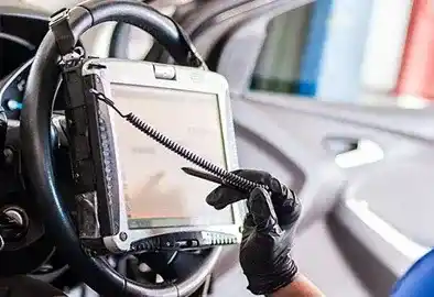 Technician running ADAS camera calibration after windshield replacement in Richardson