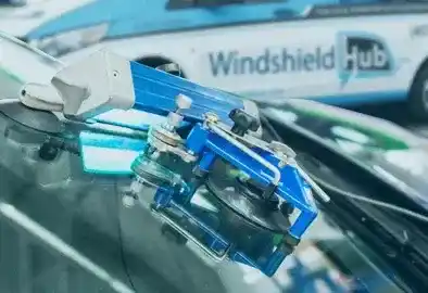 Resin injection tool repairing a windshield chip in Richardson